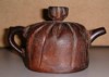 Clay tea pot which looks like a `meshed screen'